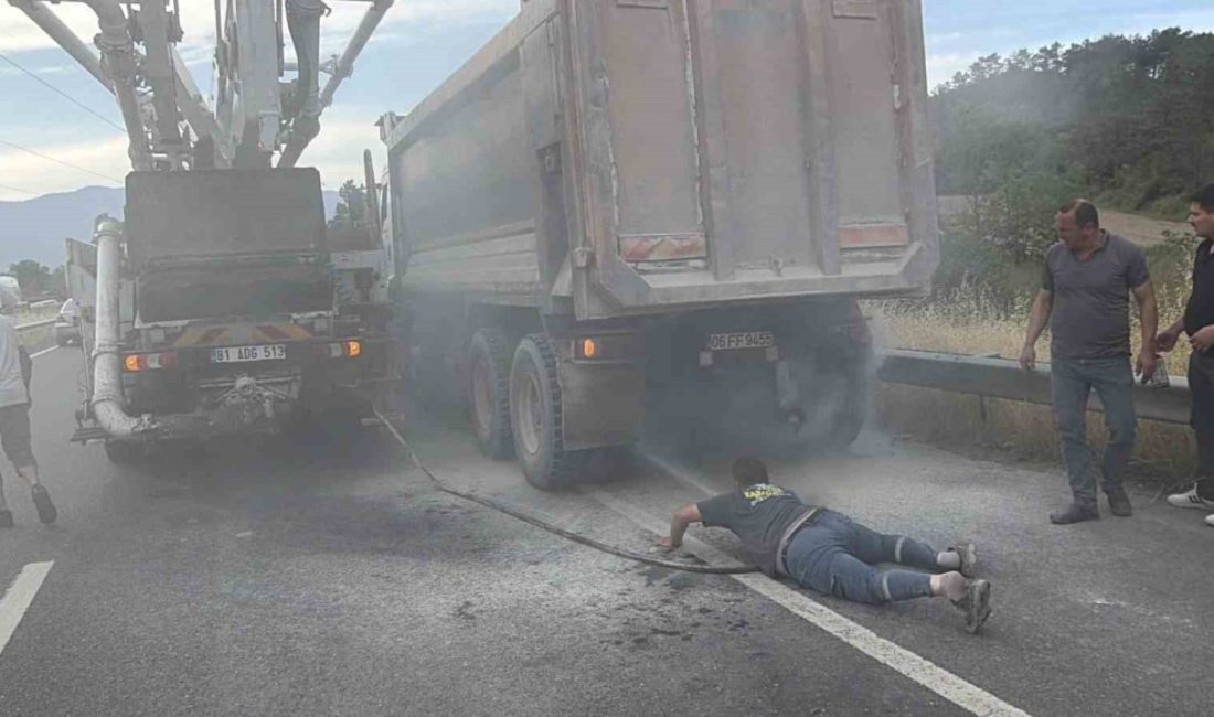 Düzce’de seyir halinde kamyonun lastiğinde çıkan yangını, beton pompası ve